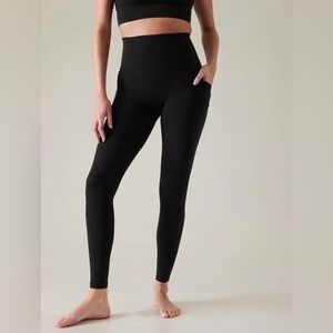 Athleta Salutation Stash Tight in Black